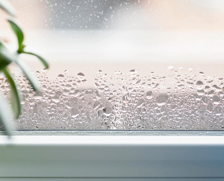 A window with lots of condensation on