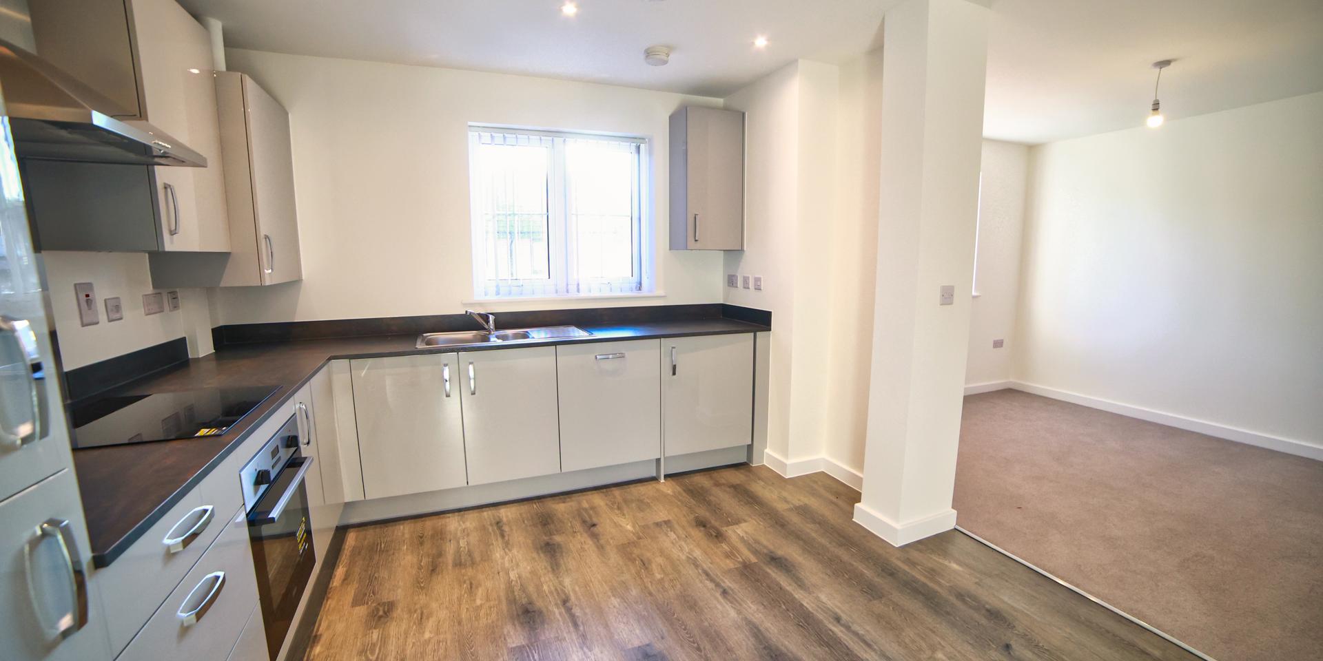 This new home has a good sized open plan living room with a kitchen diner