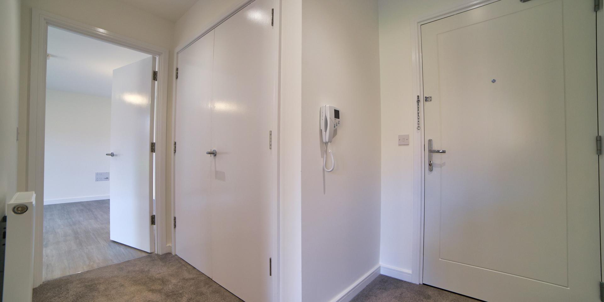 There is a large double-door storage cupboard located in the hallway