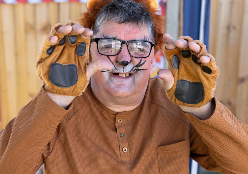 A service user dresses up like a lion