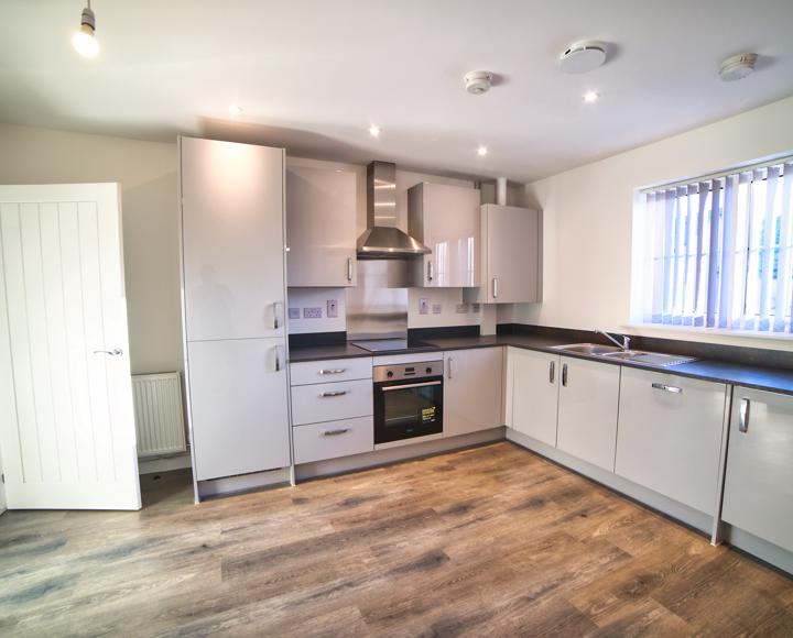 The kitchen diner has integrated appliances including washing machine, dishwasher and fridge freezer