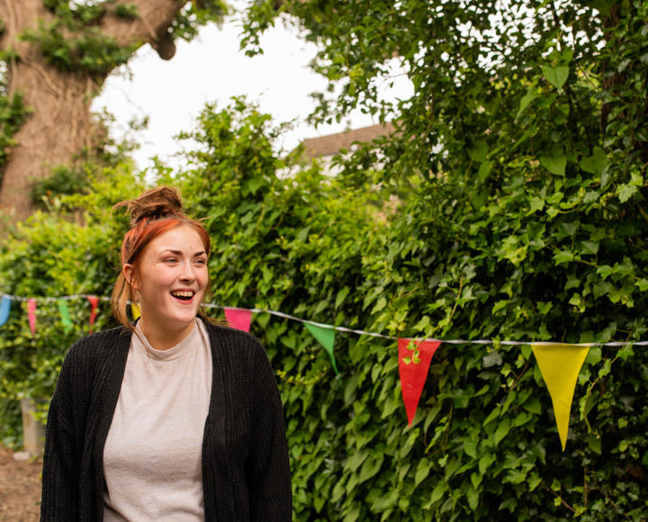Girl smiling in garden at young people's service