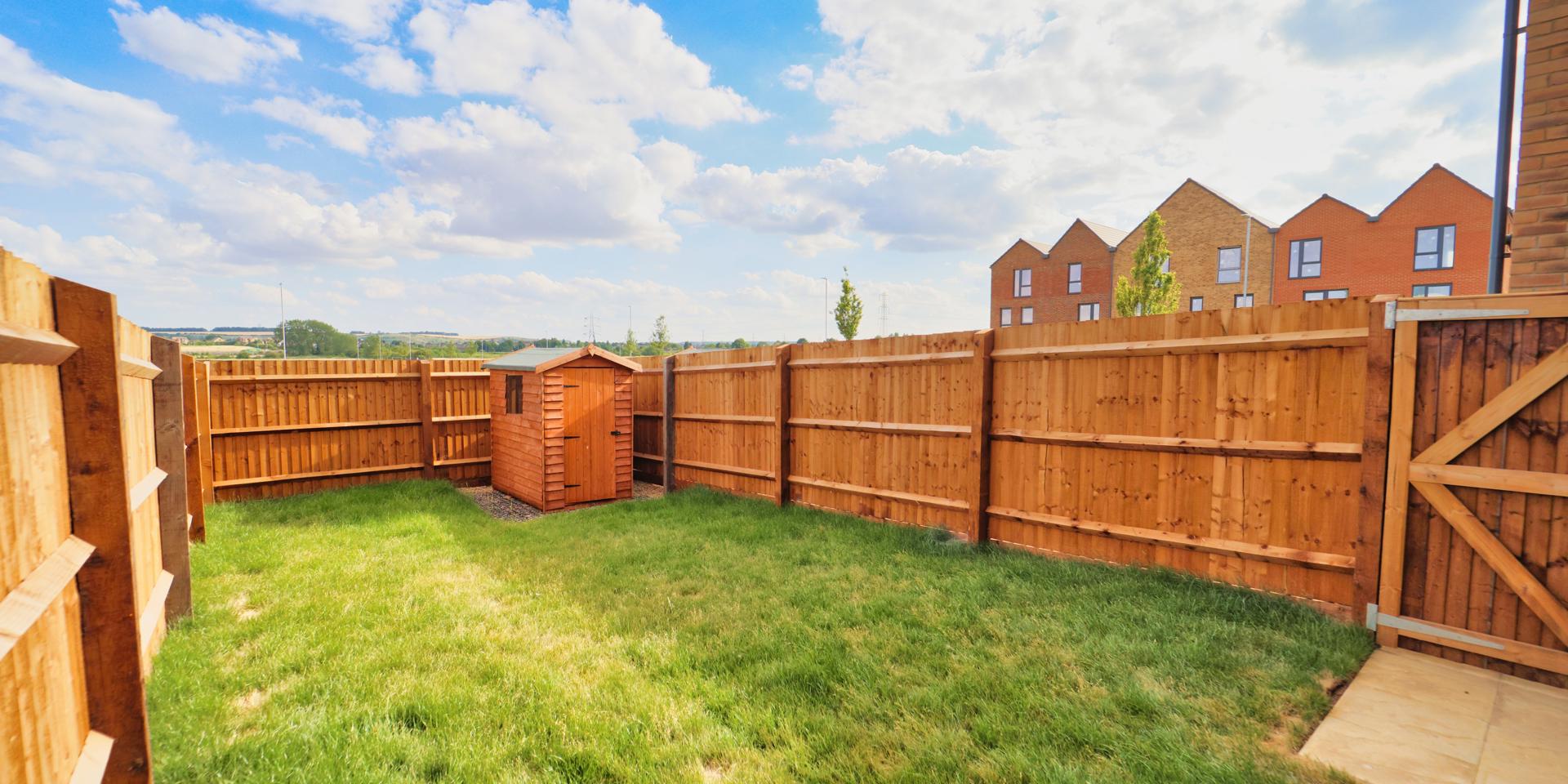 The garden is turfed and has a patio area and shed