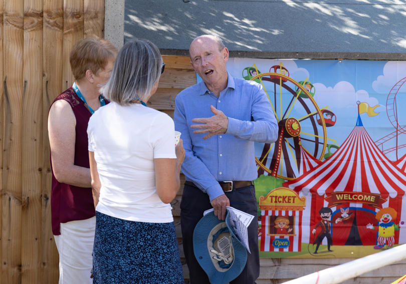 Former CEO David Bogle and Hightown staff talking in the sun