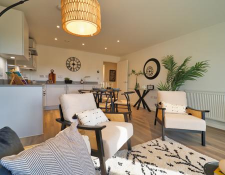 There is a 2-seater cream sofa in the living area plus 2 arm chairs