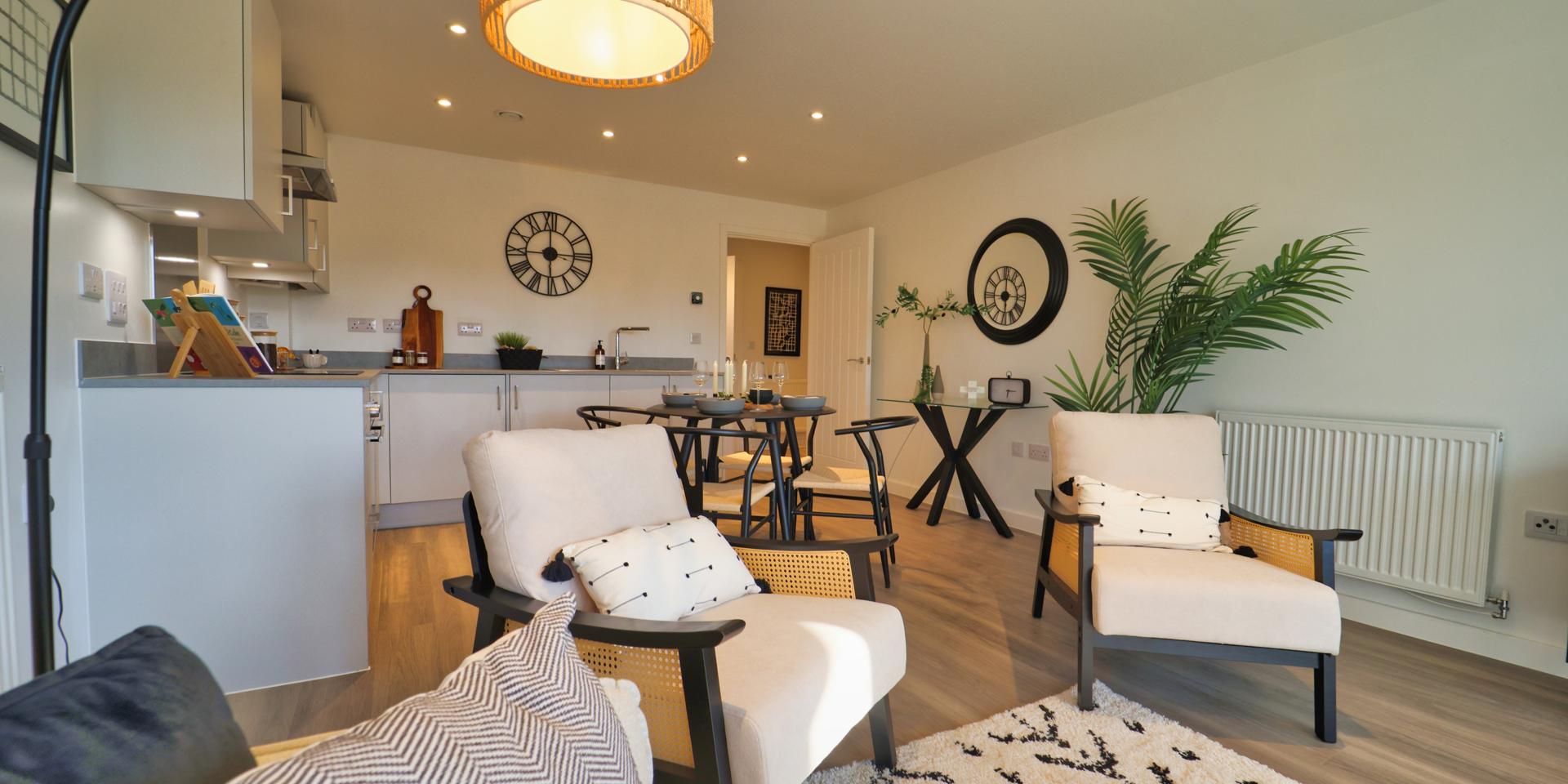 There is a 2-seater cream sofa in the living area plus 2 arm chairs