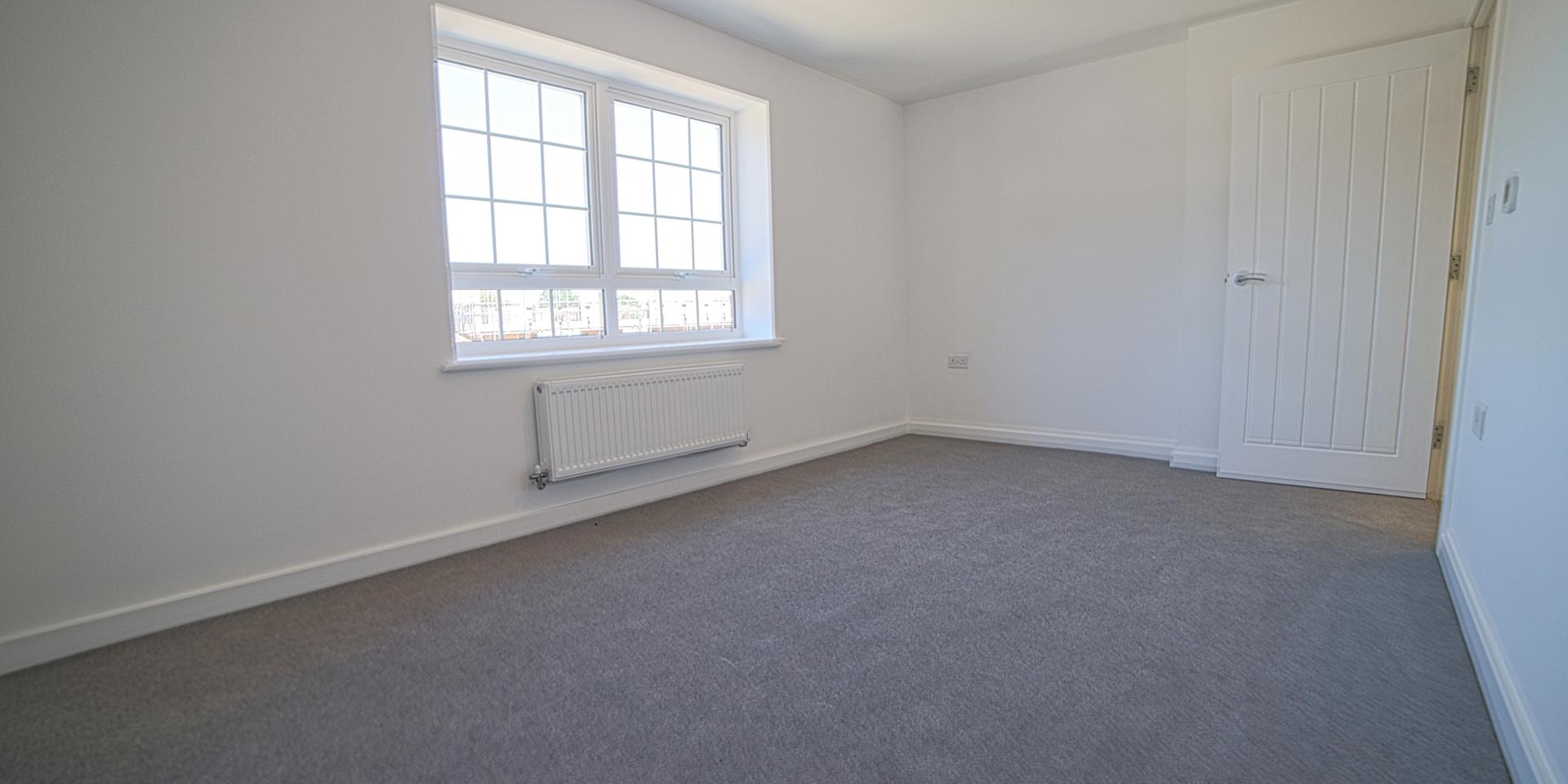 Bedroom 1 is a large double room