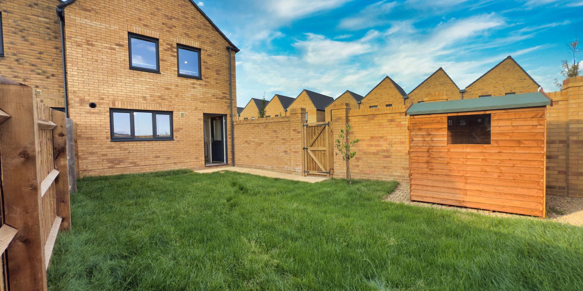 The rear garden is turfed and has a shed and side gate