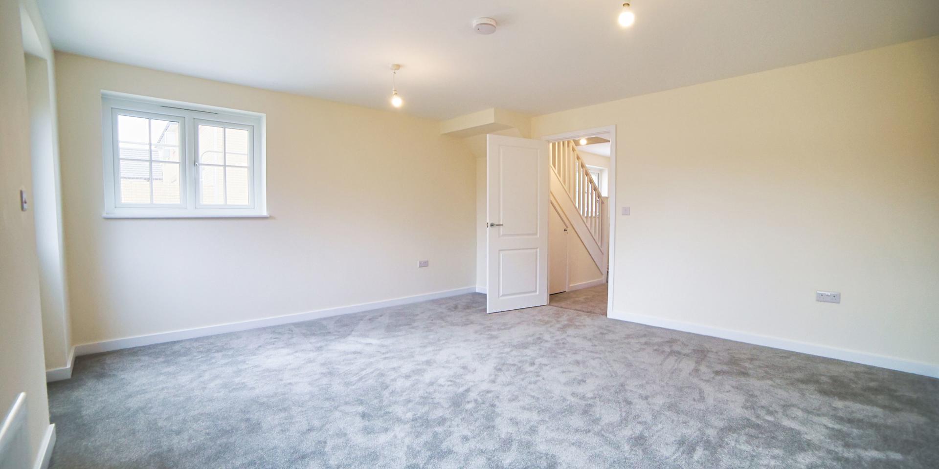 A view of the living dining room, standing from the windows