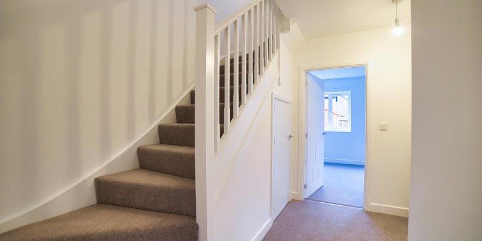 View of the hallway and the bottom of the staircase