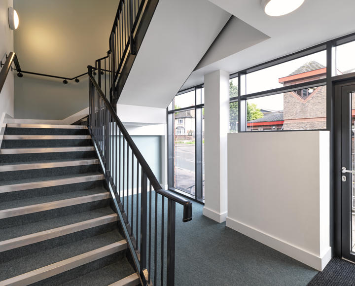 The inside of a new block of flats, showing the stairway. 