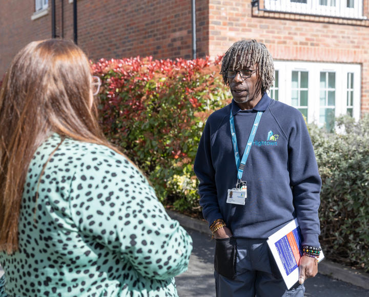 Member of staff and property services inspector are talking about the estate