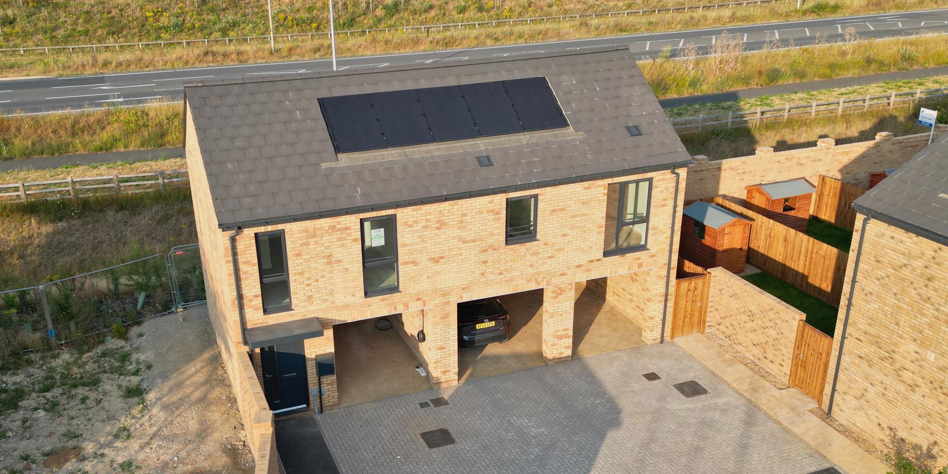 The coach house has 4 windows to the front, solar panels and 3 car port parking spaces