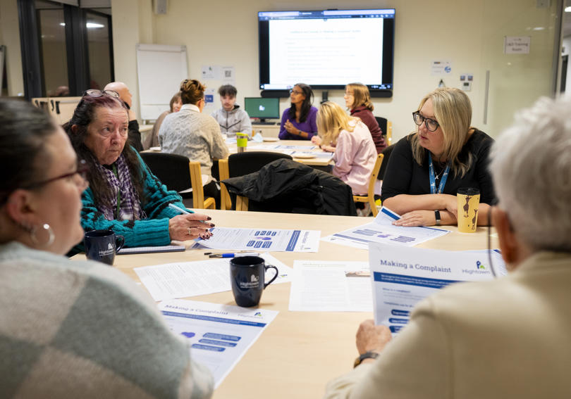 group review a leaflet at an RVSP meeting at Hightown House