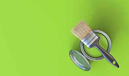 A can of paint, a paint brush and a lime green background