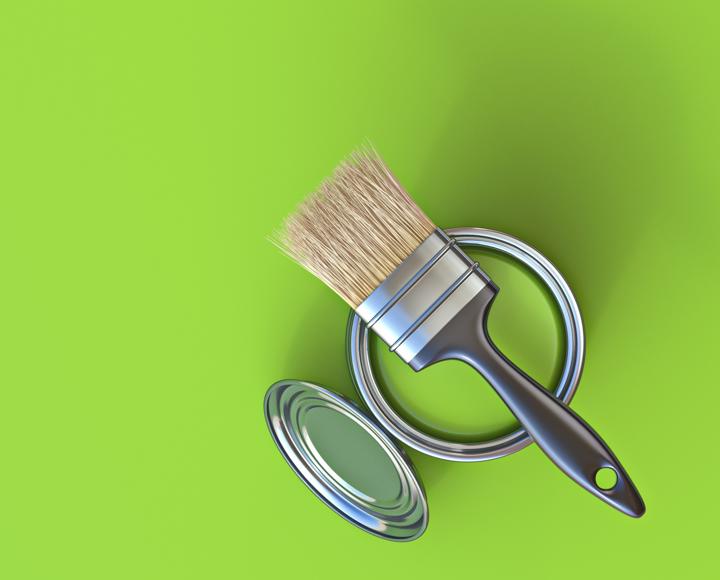 A can of paint, a paint brush and a lime green background