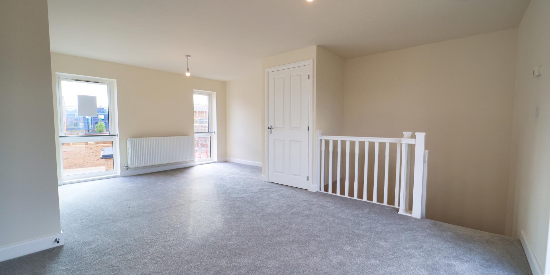 There is space to fit a dining table and chairs plus sofas and arm chairs