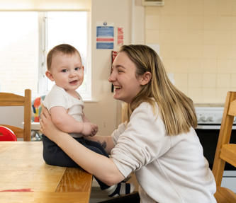 A mother sat with her young child at one of our care and supported housing schemes