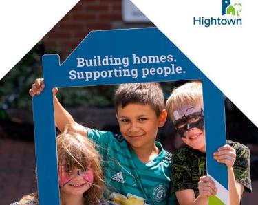 3 young children holding up a banner which says "Building homes. Supporting people" and "our impact".