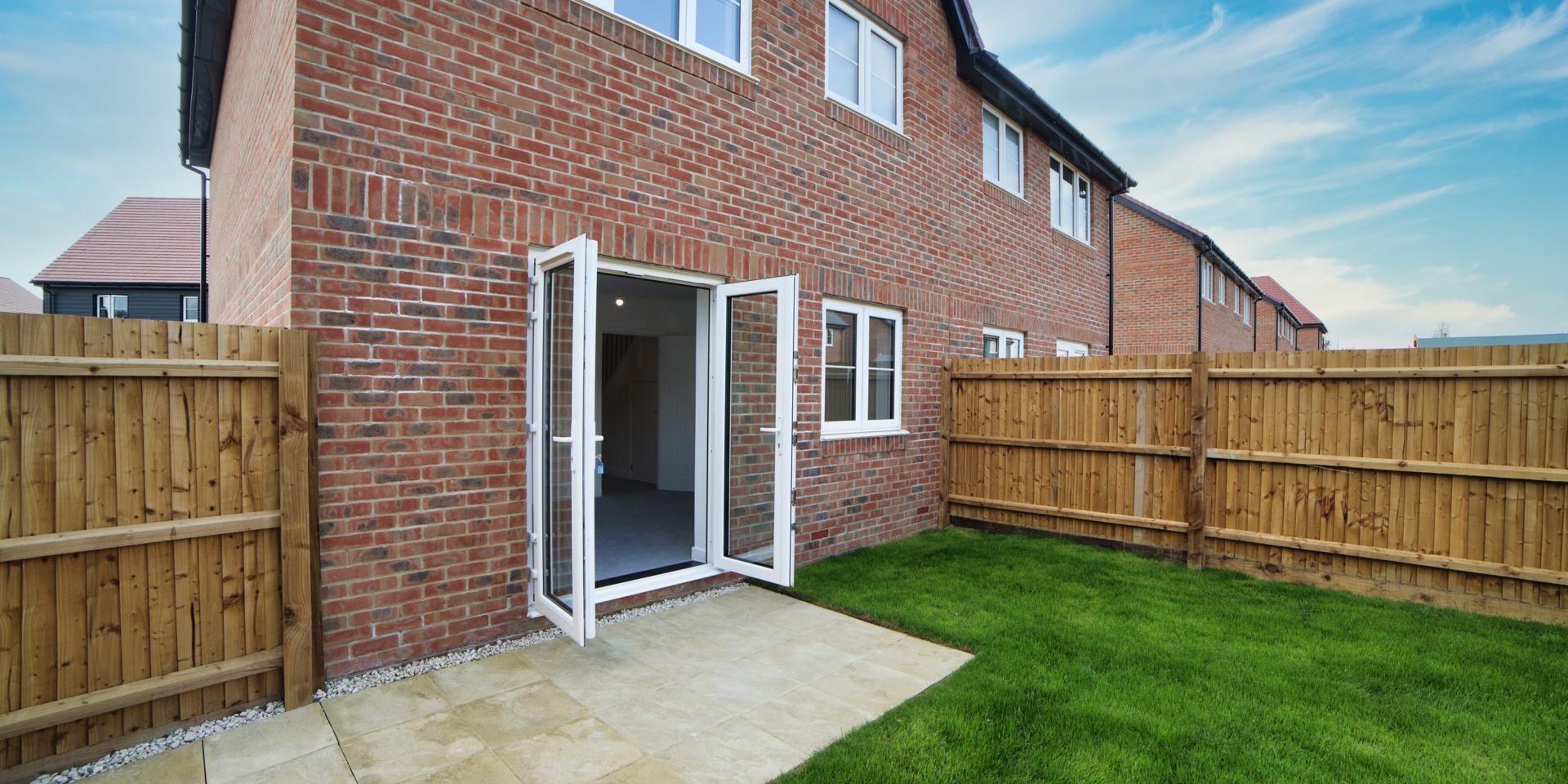 View of the double patio doors from the rear garden