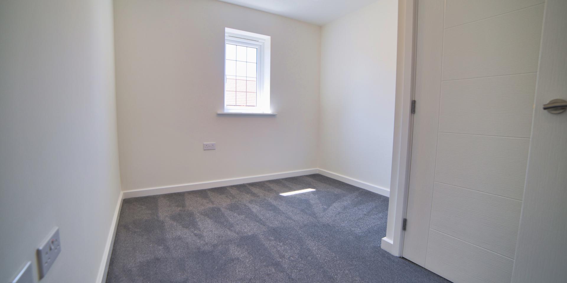 Bedroom 3 is a single bedroom with grey carpet