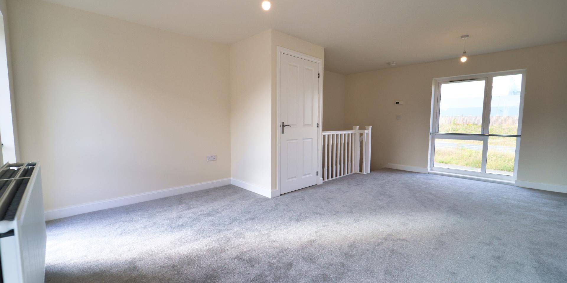 There is a handy storage cupboard located in the living area.