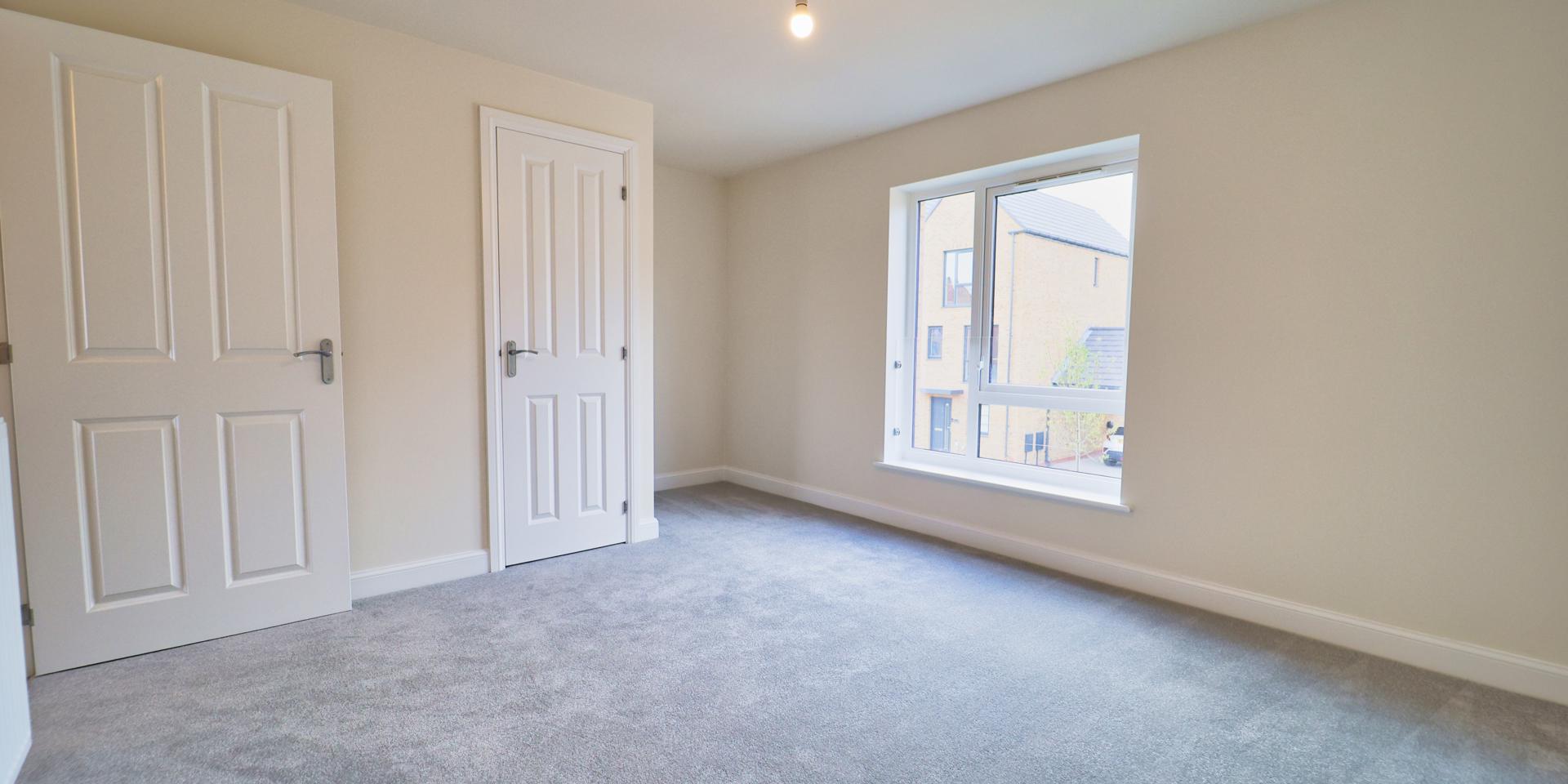 Large window and alcove where a wardrobe can be placed