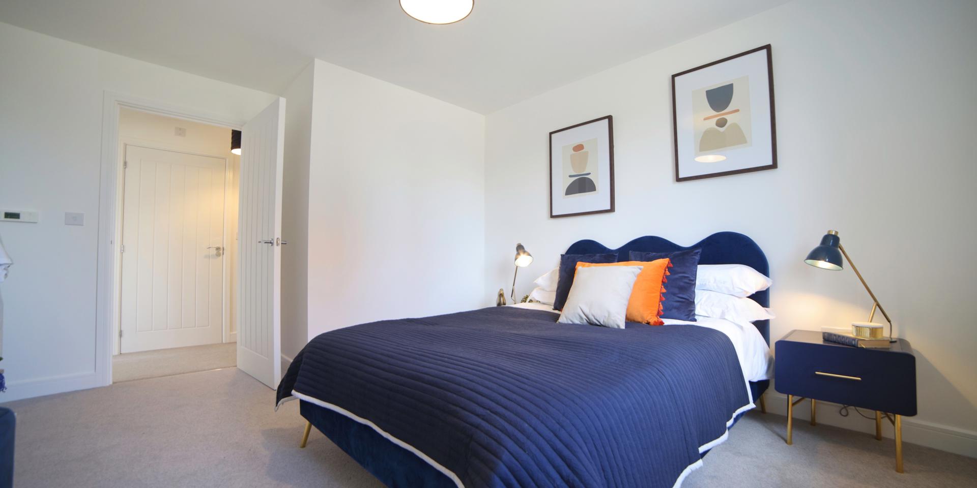 There are two bedside tables, a double bed, dressing table, stool and freestanding clothes rail in the bedroom