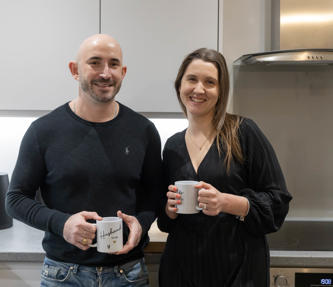 Two shared ownership residents sat in their kitchen 