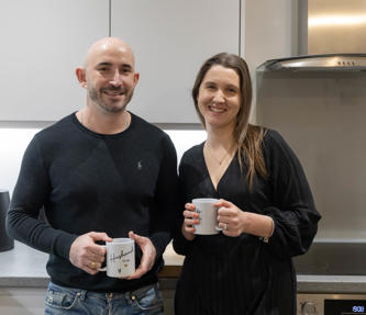 Two shared ownership residents sat in their kitchen