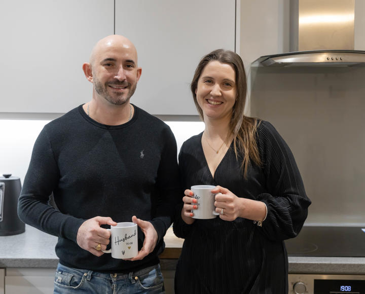 Two shared ownership residents sat in their kitchen 