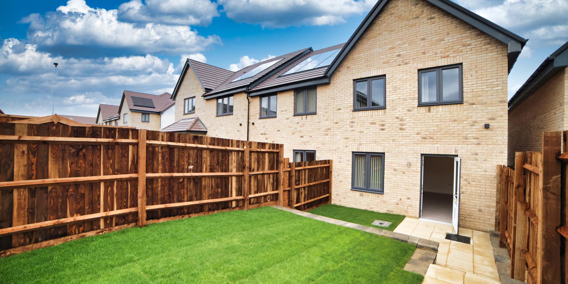 Back of the house with  a small patio area and steps