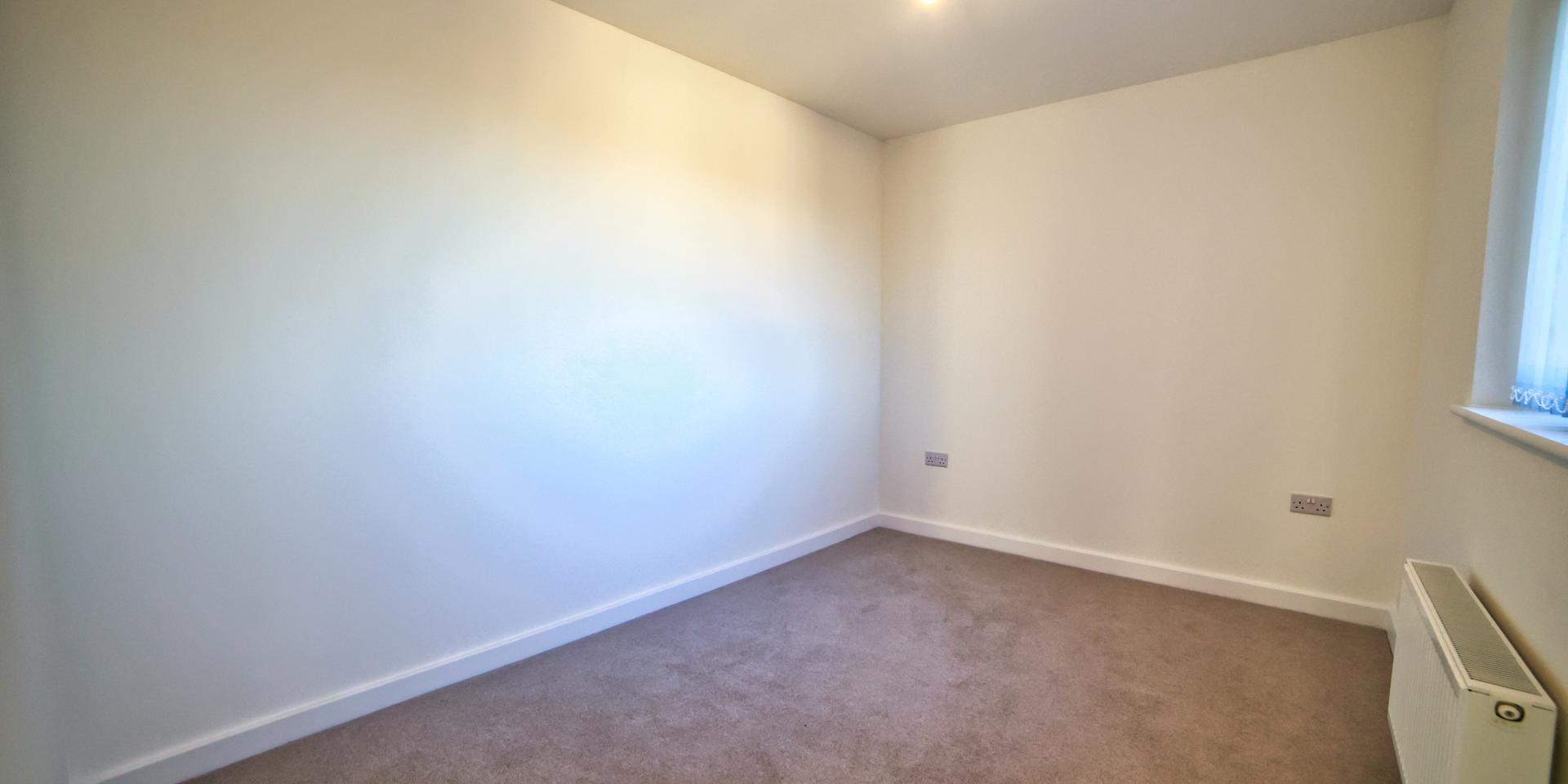 The second bedroom is large enough to fit a double bed