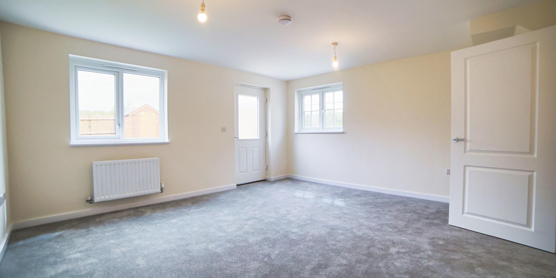 The living dining room with a door leading you out into the rear garden