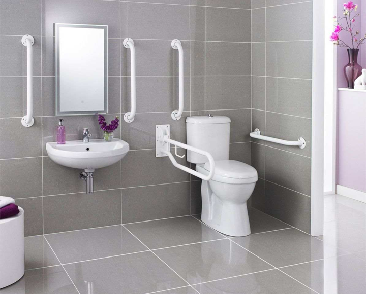 A bathroom with aids and adaptations, such as hand rails.