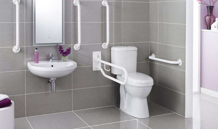 A bathroom with aids and adaptations, such as hand rails.