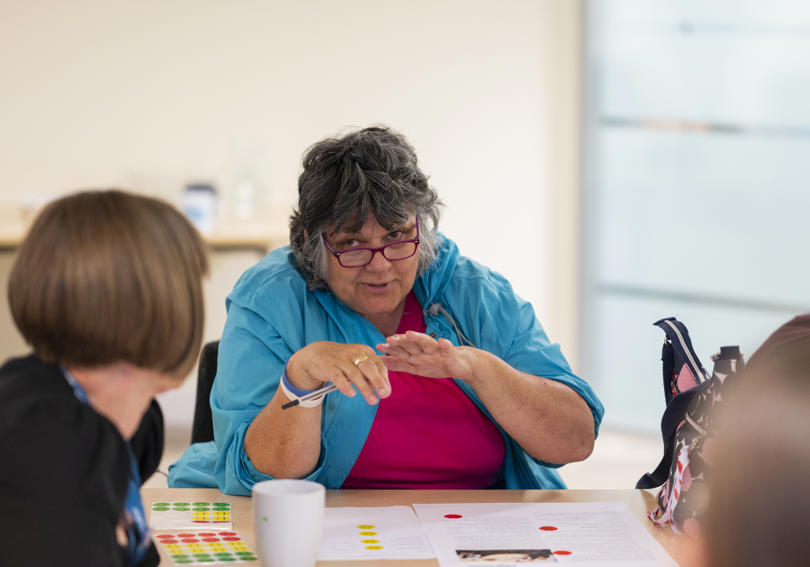 A voicebox member talking at a meeting, disucssing Hightown
