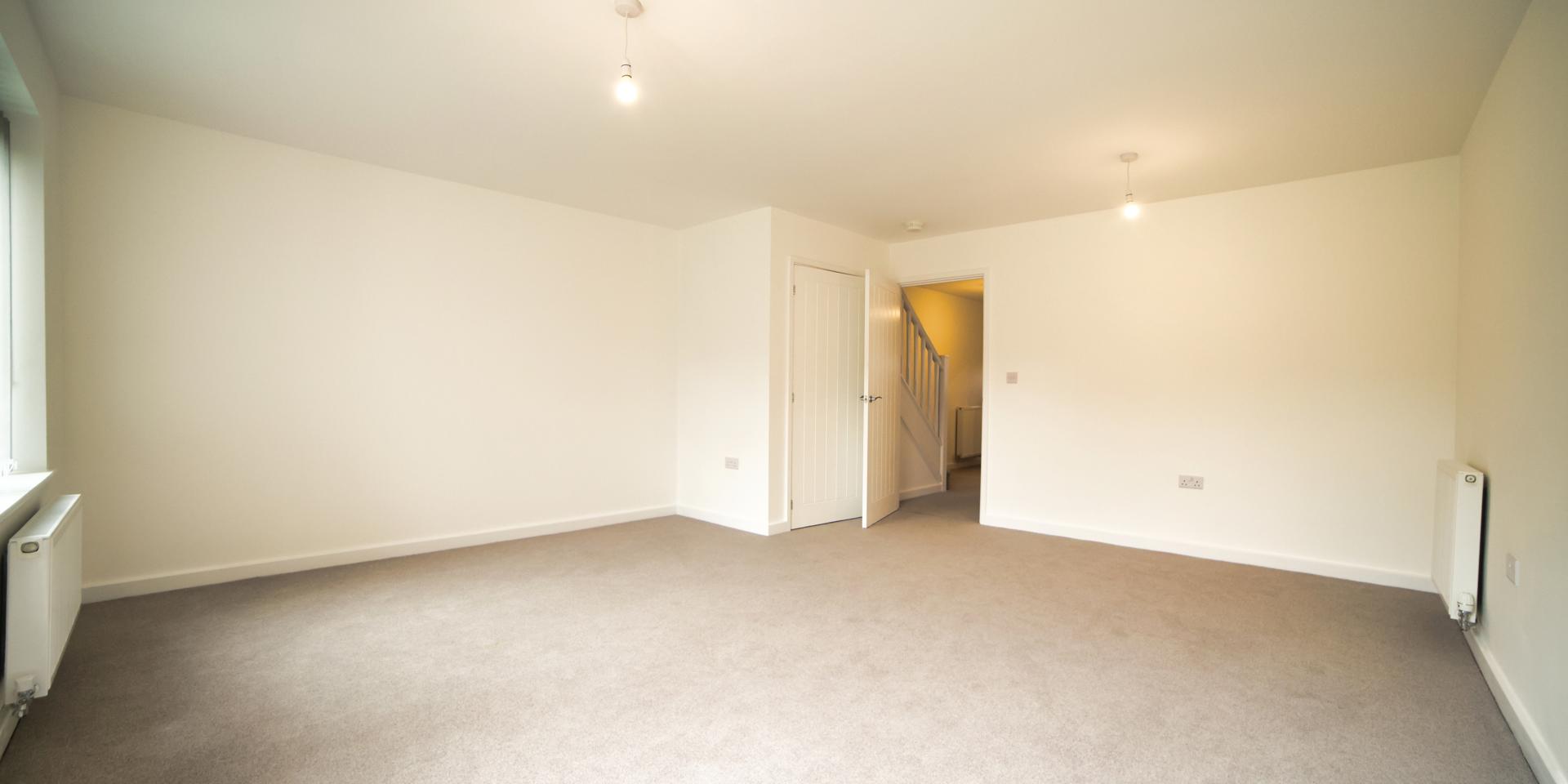 There is a storage cupboard at the back of the living area