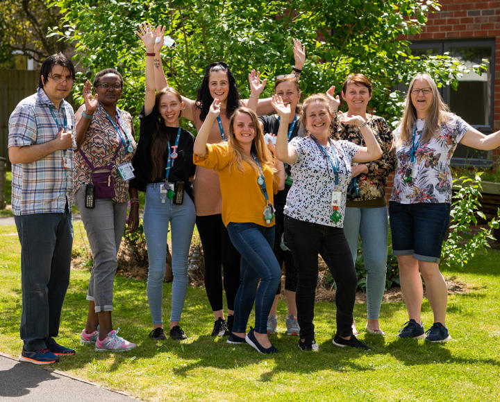 Staff members stood outside an over 55's care and supported housing scheme. 