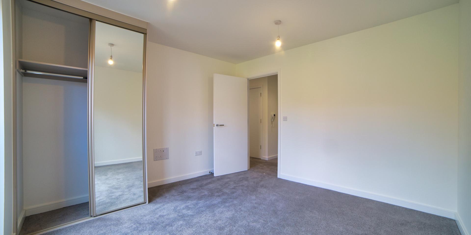 The double bedroom is a good size with built-in mirrored wardrobe and carpet