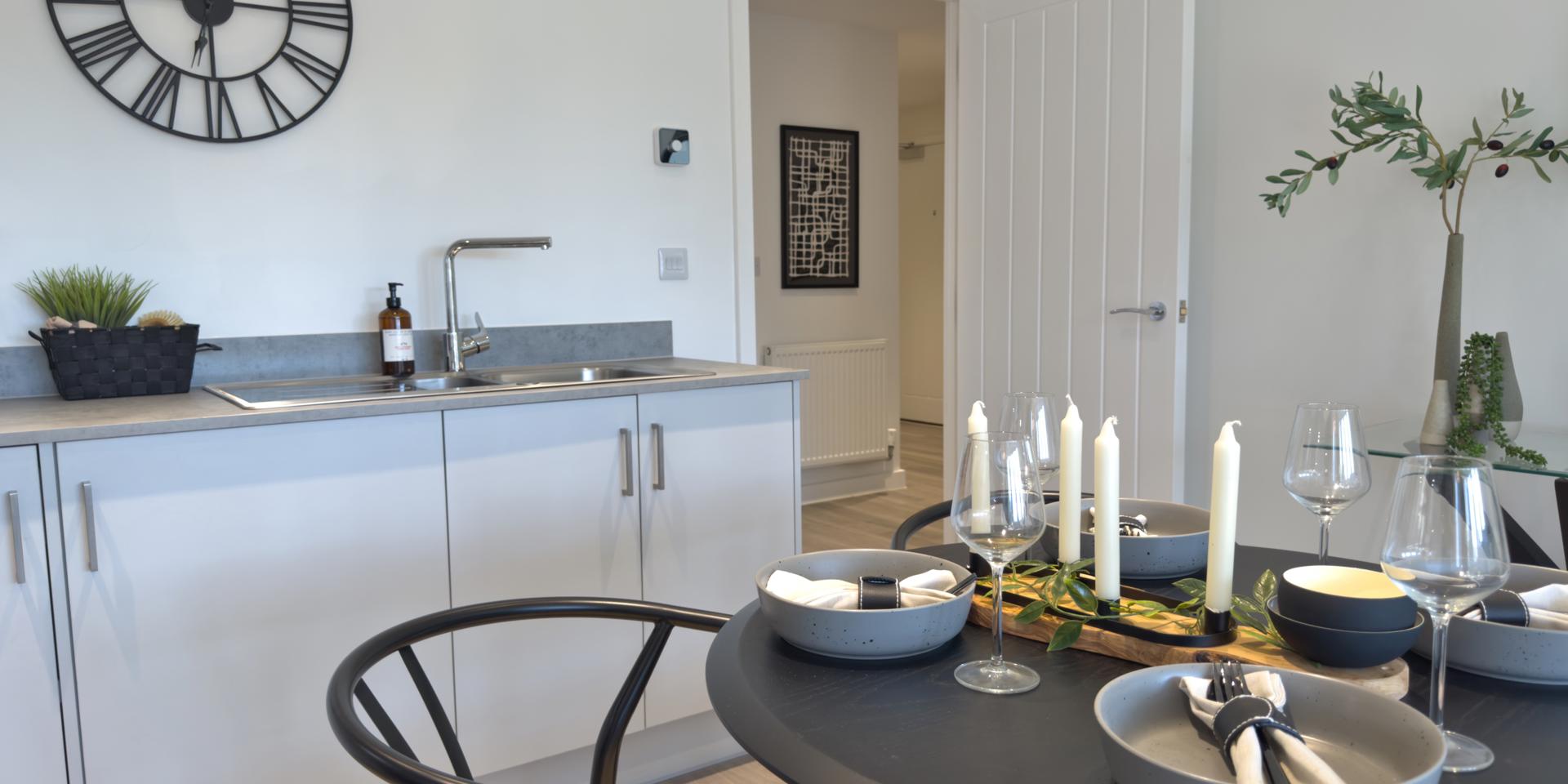 The hallway door leads into the kitchen area