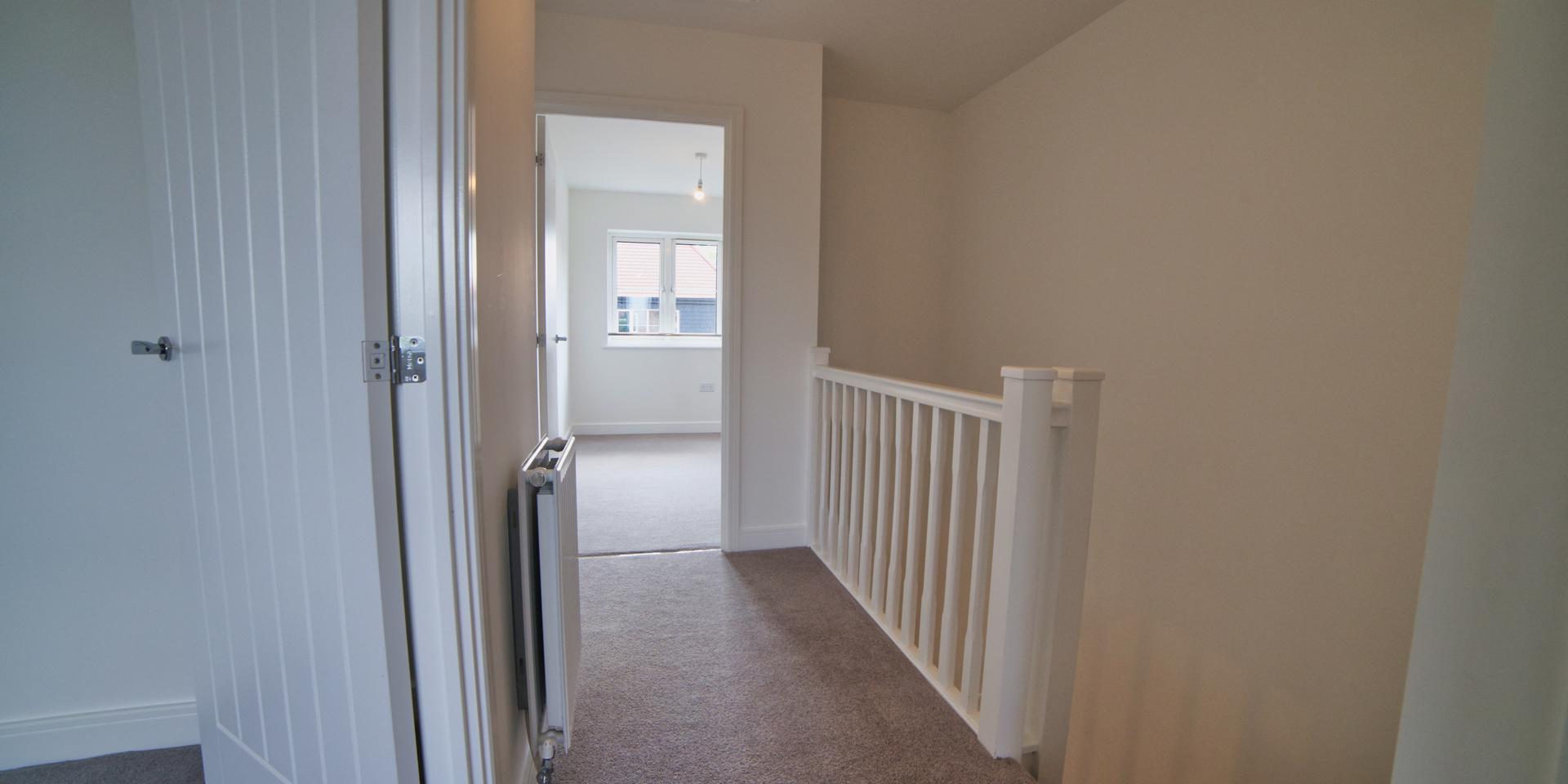 There is a banister along the landing