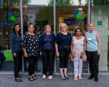 residents voice and scrutiny panel members stood outside the Hightown head office with two members of staff.