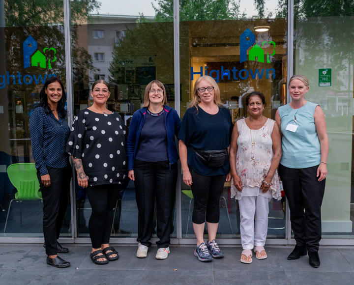 residents voice and scrutiny panel members stood outside the Hightown head office with two members of staff.