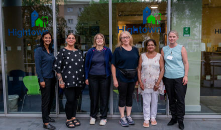 residents voice and scrutiny panel members stood outside the Hightown head office with two members of staff.