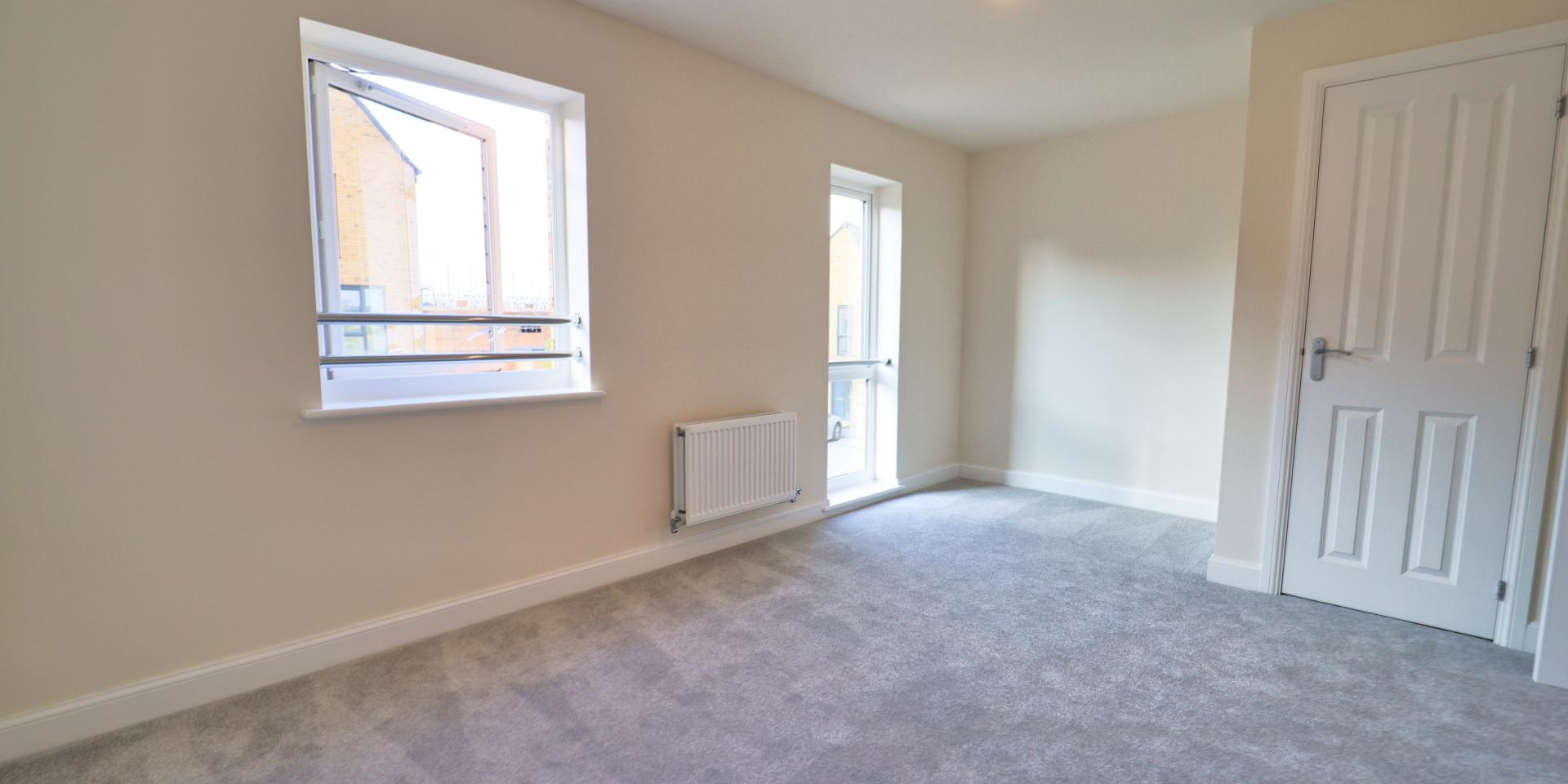 There is a large window and almost floor to ceiling window in this double bedroom