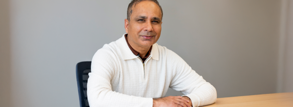 Qadeer Kiani, Chair Designate Of Hightown's Board wearing a cream jumper