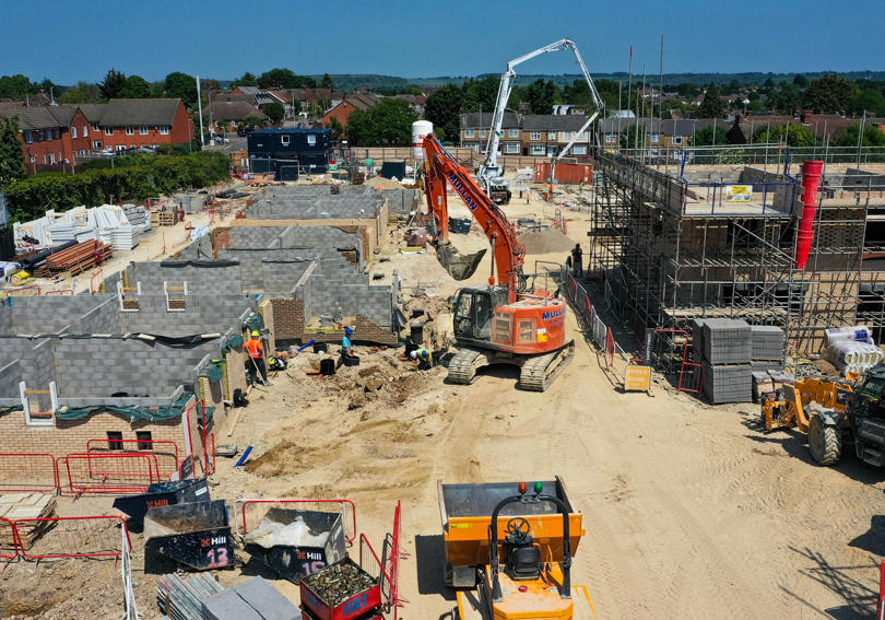 Construction work taking place on a sunny day. 