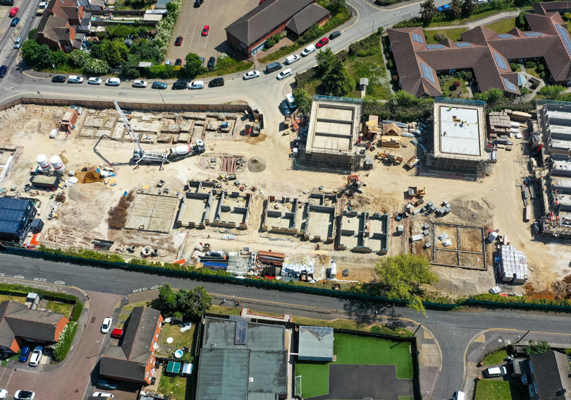 A big plot of land showing where a new development of houses is going to be built. 