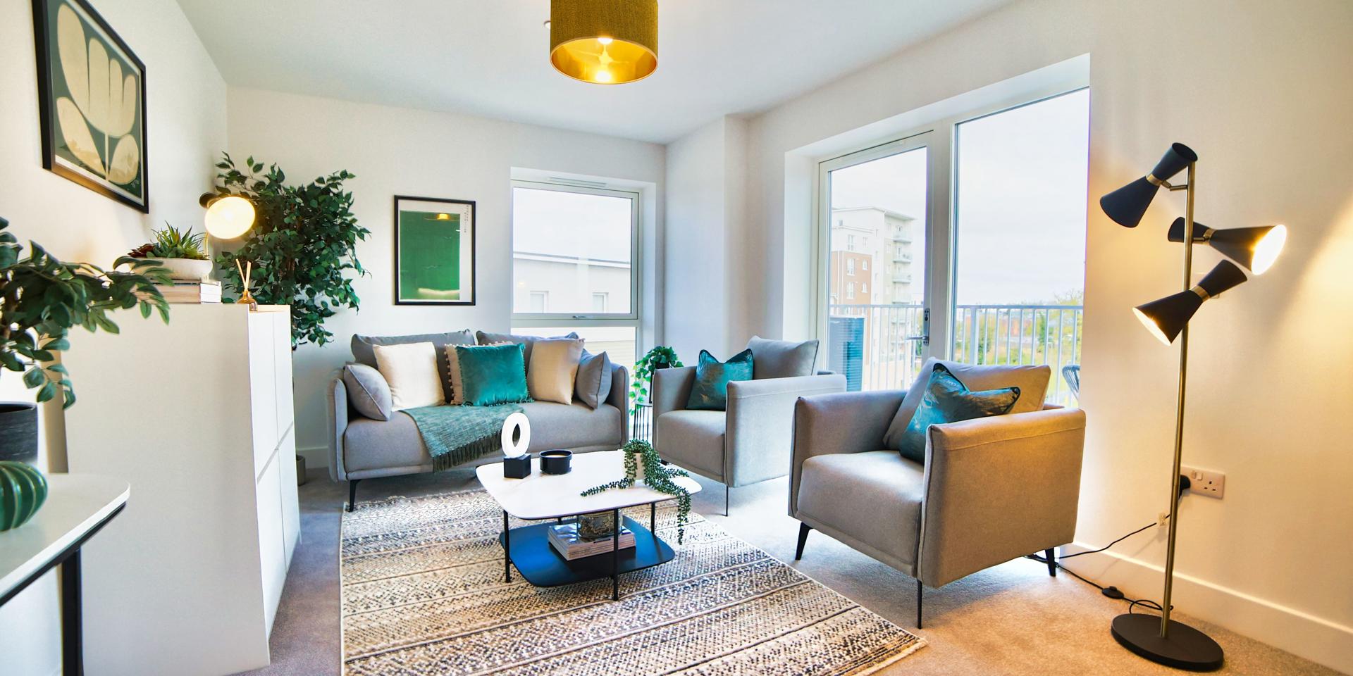 Open plan living room with double patio doors leading out onto the balcony